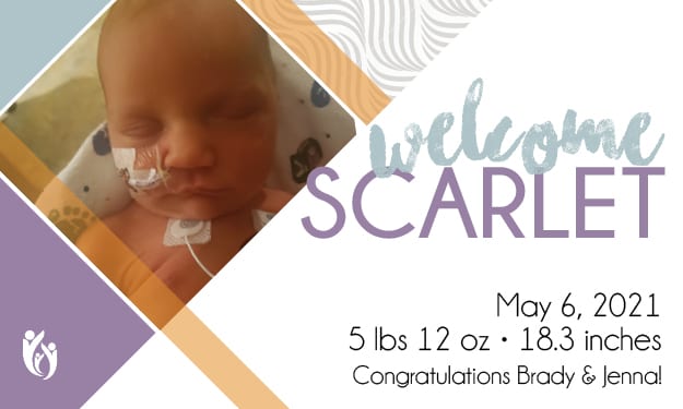 Newborn baby Scarlet with a feeding tube, eyes closed, featured on a birth announcement reading “Welcome Scarlet.” Details: 5-6-21, 5 lbs 12 oz, 18.3 inches. “Congratulations Brady & Jenna!”.