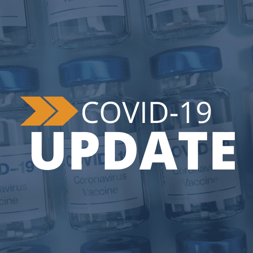 Multiple vials labeled “Coronavirus Vaccine” are shown in the background. Overlaid text says “COVID-19 UPDATE” with orange arrows pointing right, highlighting the latest COVID-19 update.