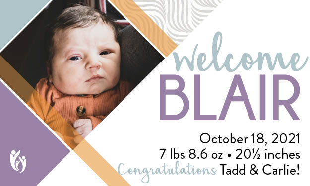 A newborn baby named Blair in an adorable orange outfit is pictured next to text announcing their birth details: “welcome BLAIR, October 18, 2021, 7 lbs 8.6 oz, 20½ inches. Congratulations Tadd & Carlie!”.