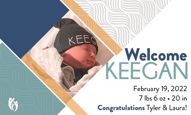 A newborn baby named Keegan, wearing a hat with “KEEGAN” written on it, sleeps peacefully next to text announcing Keegan’s birth on February 19, 2022. The announcement includes Keegan’s weight, length, and a heartfelt congratulatory message for Tyler and Laura.