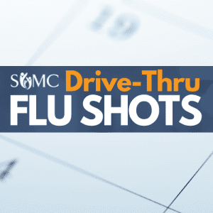 Banner advertising SOMC Drive-Thru Flu Shots, with the text “Drive-Thru Flu Shots” overlaid on a faded calendar background.