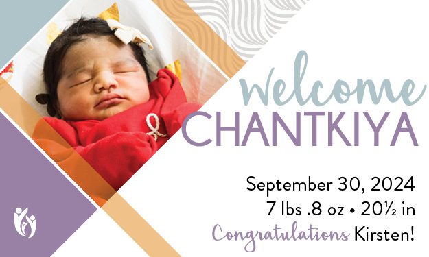 A newborn baby named Chantkiya sleeps peacefully in a red outfit with a bow headband. Born on 9-30-24, weighing 7 lbs 0.8 oz and measuring 20.5 inches, she is a bundle of joy. The text says “Welcome Chantkiya. Congratulations Kirsten!”.