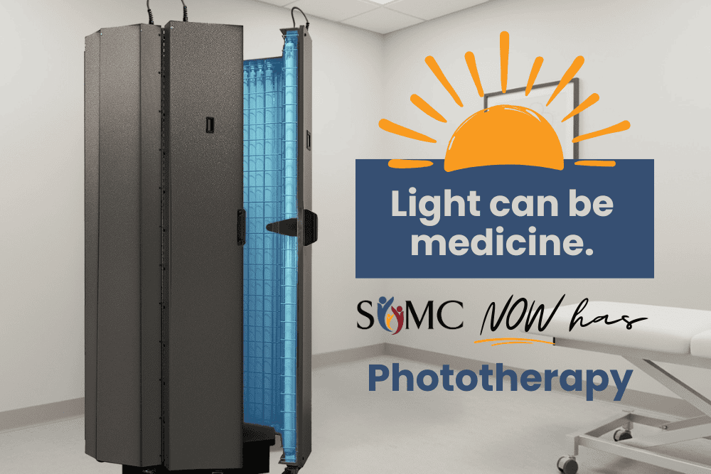 A medical phototherapy device stands in a clinical room. Text says, “Light can be medicine. SOMC NOW offers advanced Phototherapy.” A stylized sun icon is above the words.
