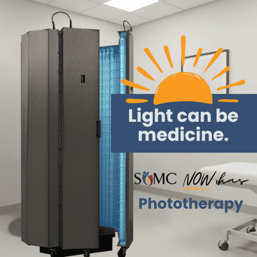 A phototherapy machine in a medical room with text: “Light can be medicine. SOMC now has Advanced Phototherapy,” and a sun graphic above the words, highlighting the innovative treatments offered by SCMC Dermatology.